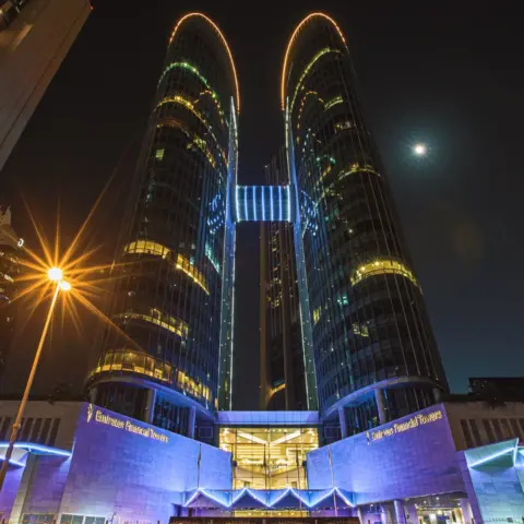 DIFC Proposes Major Overhaul to Arbitration - Enchanting night shot of Emirates Financial Towers in Dubai, UAE, illuminated b