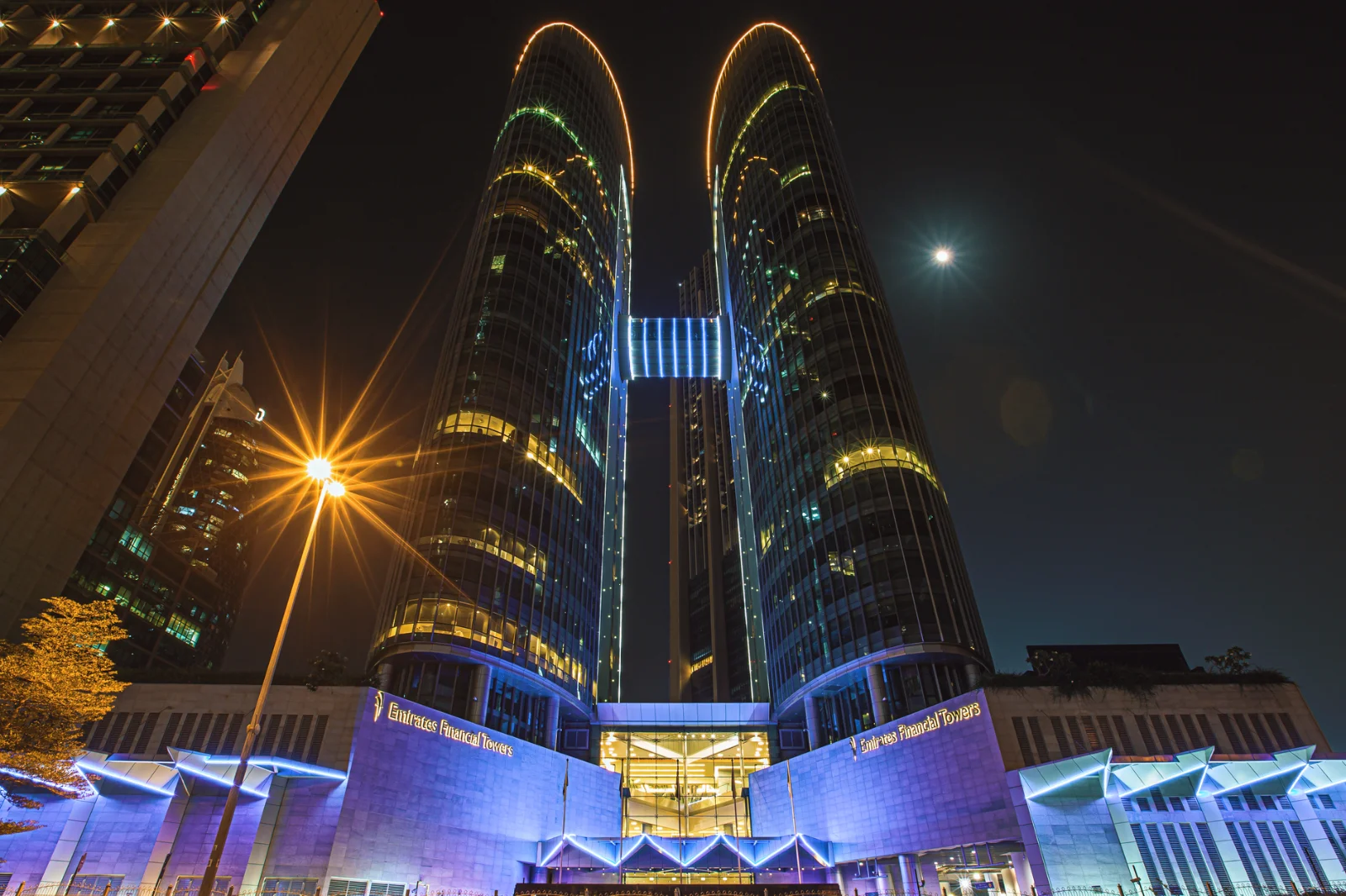 DIFC Proposes Major Overhaul to Arbitration - Enchanting night shot of Emirates Financial Towers in Dubai, UAE, illuminated b