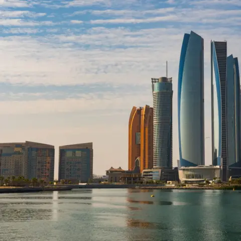 News Update: Abu Dhabi Imposes Immediate - Breathtaking view of Abu Dhabi skyline showcasing modern architecture and iconic l