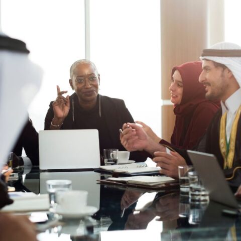 Business leaders discussing Non-Profit Companies during a corporate board meeting in the UAE.