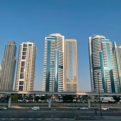 a group of tall buildings sitting next to each other